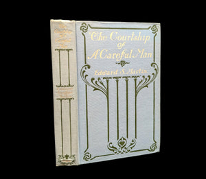 First edition of 'The Courtship of A Careful Man' by Edward Sanford Martin, featuring a decorative book cover with gold accents.