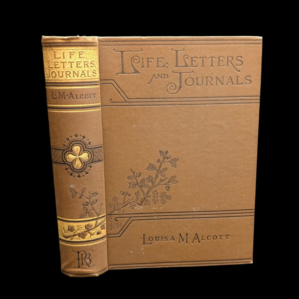 Cover of the book 'Life, Letters, and Journals' by Louisa May Alcott, showing the title and author's name, with decorative floral patterns.