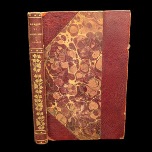 An old book titled 'Lyrics of Lowly Life' by Paul Laurence Dunbar with a decorative floral pattern on the cover. The book appears to be from the early 20th century and has significant tape on the inside binding.
