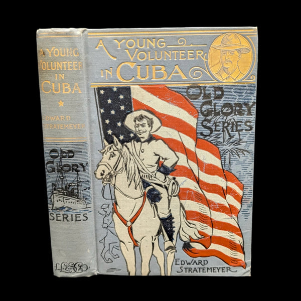 Cover of the book 'A Young Volunteer in Cuba, or, Fighting For The Single Star, 1898' featuring an illustration of a man on horseback with a flag.
