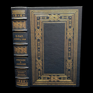 Leather-bound collector's edition book titled 'D-Day June 6, 1944' by Stephen E. Ambrose, featuring gold embossed decorations on the cover.
