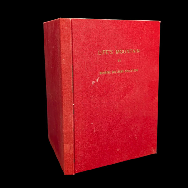 A red hardcover book titled 'Life's Mountain' by Maurine Williams Sellstrom with visible signs of wear.
