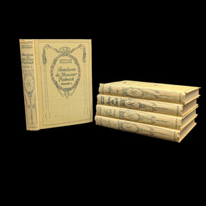 A set of hardcover books with aged yellowing pages and decorative book covers, bound together with a ribbon bookmark.