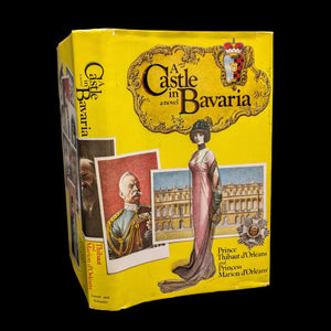 A yellow book cover of 'A Castle In Bavaria' featuring illustrations of a castle, a man in a suit, and a woman in an elegant dress.