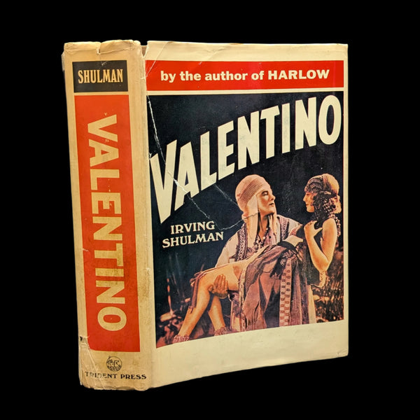 A hardcover book titled 'Valentino' by Irving Shulman with a red and yellow cover, featuring an illustration of two individuals.