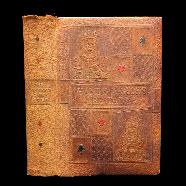 A worn hardcover book titled 'The Complete Card Player, 1945' with embossed decorations on the cover.