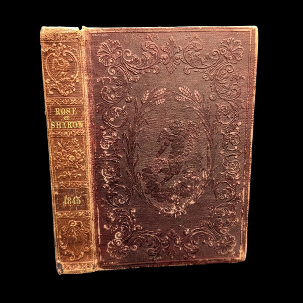 Cover of the book 'The Rose Of Sharon, A Religious Souvenir For MDCCCXLV (1845)' featuring ornate embossed leather binding with floral patterns.