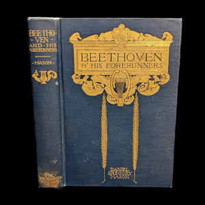 The cover of the book 'Beethoven And His Forerunners' by Daniel Gregory Mason features a title and author's name in gold lettering on a dark blue background. The book's cover also displays a decorative border and has the inscription of the prior owner on the front.