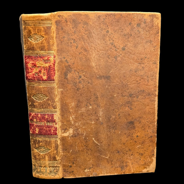The image shows the back cover of an old, hardcover book with a leather binding. The cover is predominantly brown with some decorative embossing details.