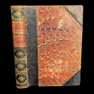 An old book with a decorative cover featuring red and gold colors, titled 'Lectures On Shakespeare, In Two Volumes, 1848'. The book appears to be leather bound.