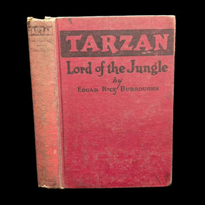 The cover of the book 'Tarzan: Lord of the Jungle' by Edgar Rice Burroughs, featuring a red background with black text.