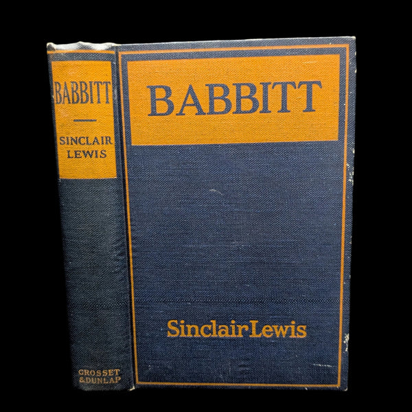 A hardcover edition of 'Babbit' by Sinclair Lewis with a blue and yellow cover, published by Grosset & Dunlap, New York.