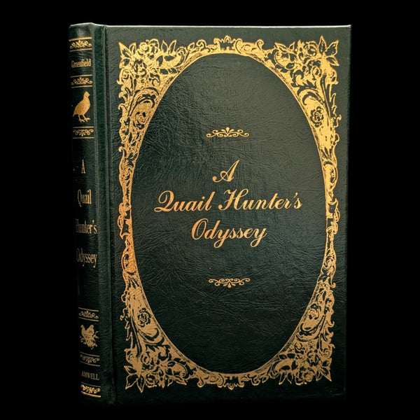 A hardcover edition of 'A Quail Hunter's Odyssey' with a black and gold cover design, including ornate gold detailing around the text.