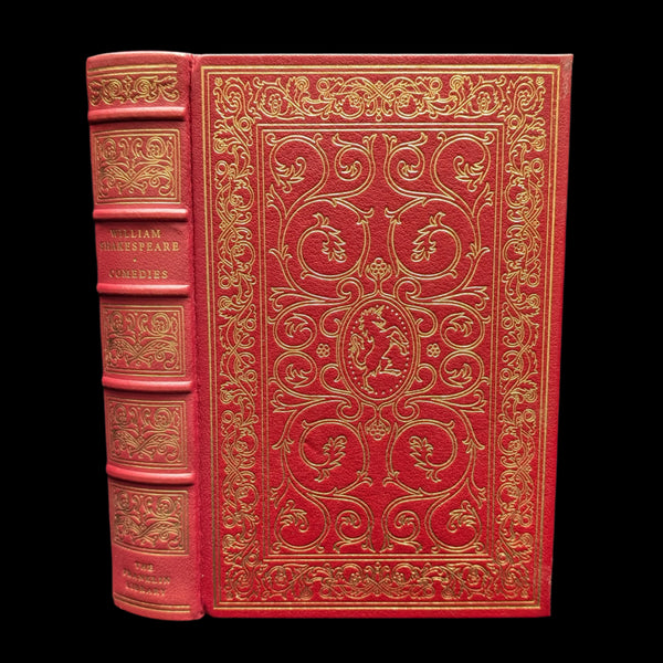 A red leather bound book with gold embossed decorations, titled 'William Shakespeare Comedies, The Franklin Library, 1978'.