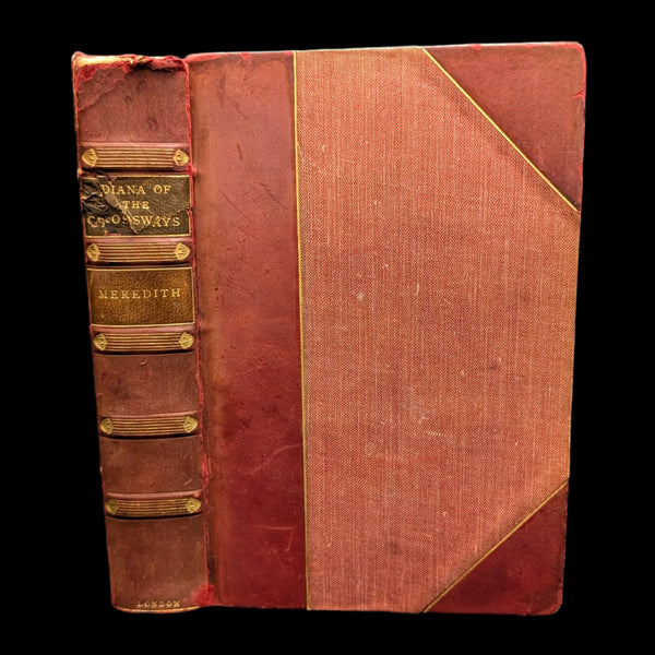 An old edition of the novel 'Diana Of The Crossways' by George Meredith, featuring a leather bound cover with gold detailing.