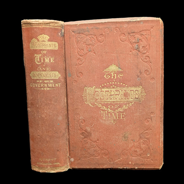 A photo of a old book titled 'The Footprints of Time: And A Complete Analysis of the American System of Government' with a red cover and decorative embossed patterns.