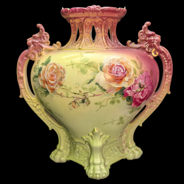 Antique Royal Bayreuth Bavaria Germany vase with hand-painted roses, ornate handles, and a warm pink and gold gradient.