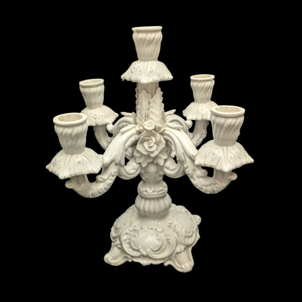 A vintage Italian white porcelain candelabra with a hand-made floral design, featuring four arms and five candle holders.