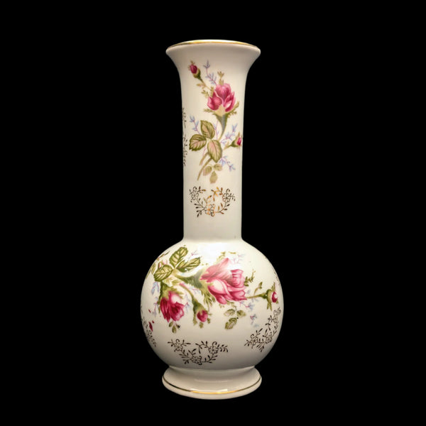 A vintage L&M Inc. porcelain vase with a floral design, featuring pink roses and green leaves, with subtle gold trim.