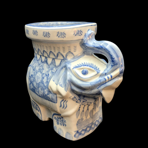 A large porcelain floor figurine in the shape of an elephant, featuring a blue and white floral pattern.