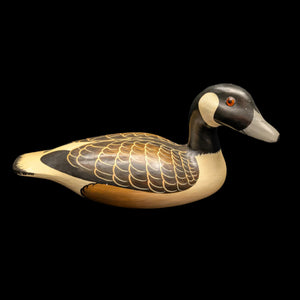 A vintage hand-carved and hand-painted Canadian goose decoy.