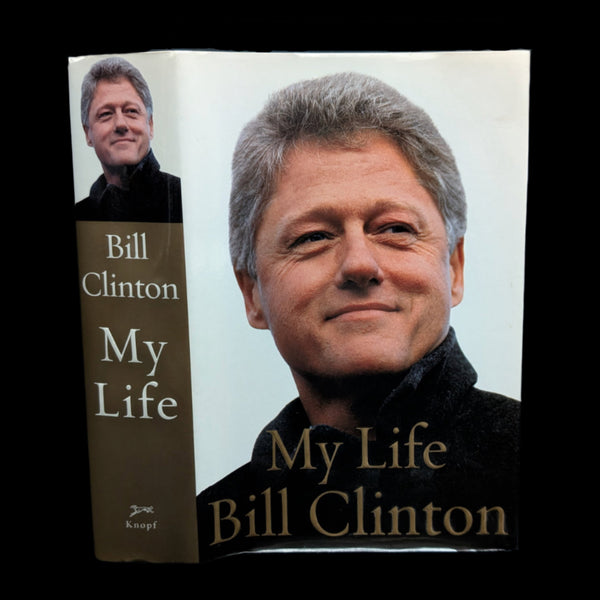 A signed first edition book cover of 'My Life' by Bill Clinton, featuring a photograph of the author and title text.