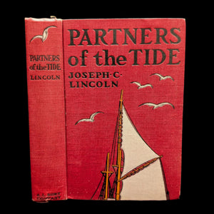 Cover of the book 'Partners Of The Tide' by Joseph C. Lincoln featuring illustrations of a sailboat and seagulls, with a red background.