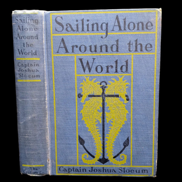 Cover of the book 'Sailing Alone Around the World' by Captain Joshua Slocum, featuring a yellow design with an anchor and decorative elements on a blue background.