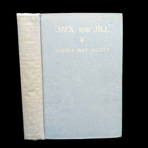 A hardcover book titled 'Jack And Jill' by Louisa May Alcott, with a blue cover and white spine.
