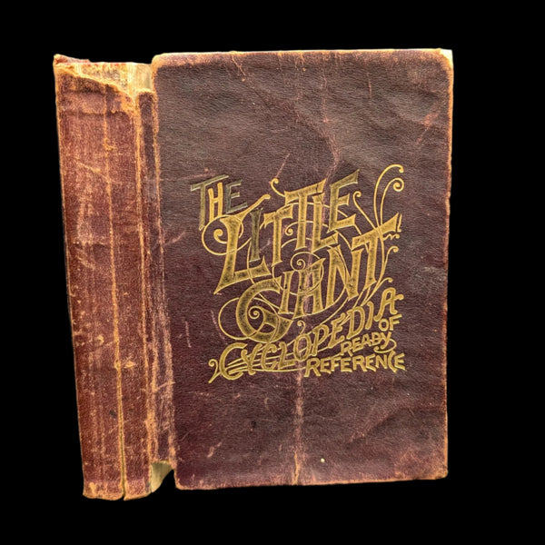 An old, leather-covered book with ornate gold lettering on the cover, titled 'The Little Giant Cyclopedia And Treasury Of Ready Reference, 1892'. The book appears worn and has a previous owner's inscription.