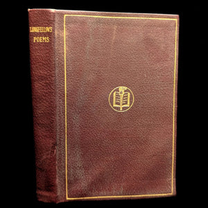 Cover of the book 'Poems of Henry W. Longfellow' with a dark leather binding and a decorative gold design in the center.