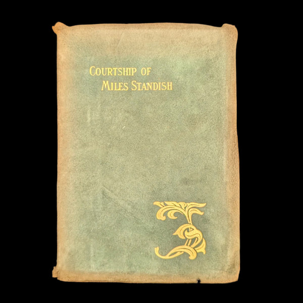 Cover of the book 'The Courtship Of Miles Standish' by Henry W. Longfellow, showing title and author's name, with a decorative element on the cover.