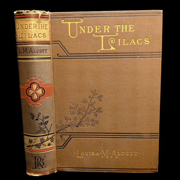 Cover of the book 'Under The Lilacs' by Louisa M. Alcott, featuring illustrations and the title printed on the front and back cover.