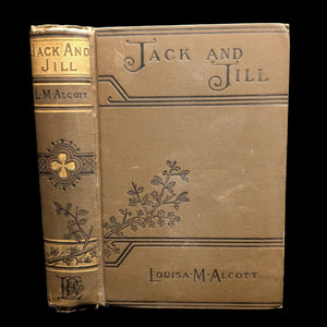 Cover of the book 'Jack And Jill, A Village Story' by Louisa M. Alcott, featuring decorative floral patterns and the title and author's name.