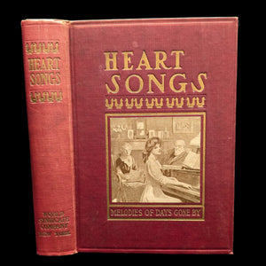 Cover of the book 'Heart Songs, Dear To The American People' featuring an illustration of a person at a piano.
